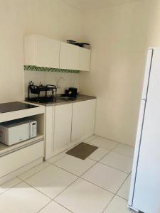 Η κουζίνα ή μικρή κουζίνα στο Apartamento completo para familia com dois quartos