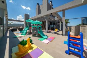 Legeområdet for børn på Apartamento com Vista Mar e Piscina