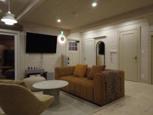 TV a/nebo společenská místnost v ubytování Lucent NISEKO