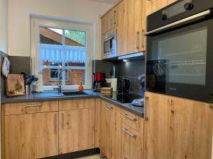 Kuchyň nebo kuchyňský kout v ubytování Holiday home with 2 bedrooms