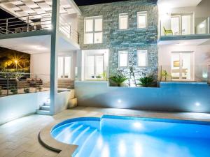 a pool in the middle of a room with a building at Villa in Bol with swimming pool in Bol