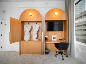 a room with a desk and a room with two hangers at Symons Block Suite 7 in Spokane