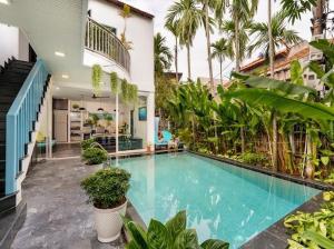 a large swimming pool in the middle of a building at Emerald Coast House in An Bàn (2)