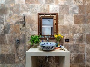 a bathroom counter with a sink and a mirror at Emerald Coast House in An Bàn (2) +29 photos