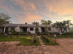 a house with a garden in front of it at Sea Escape Koh Yao Yai in Ko Yao Yai