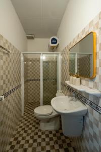 a bathroom with a toilet and a sink at Elva Shine Dalat Hotel in Da Lat