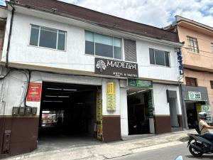 a motorcycle parked in front of a building at Hotel Madeira in Manizales