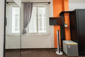 a room with a window and a glass door at Elva Shine Dalat Hotel in Da Lat +81 photos
