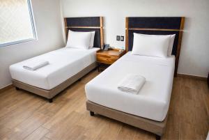 Ένα ή περισσότερα κρεβάτια σε δωμάτιο στο Hotel Vía Norte - Business con parking y acceso rápido al Periférico