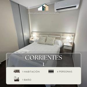 a picture of a room with a bed and two tables at Dpto Temporario 1 - Corrientes - PQ ALQUILERES TEMPORARIOS in Corrientes