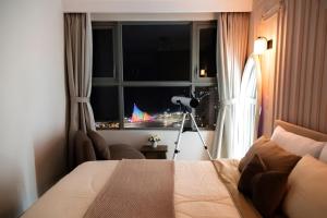 Postel nebo postele na pokoji v ubytování Sea Blooming - The Sóng Vũng Tàu - Gần Biển, Miễn Phí Hồ Bơi, Sauna, Gym + 110 fotografií