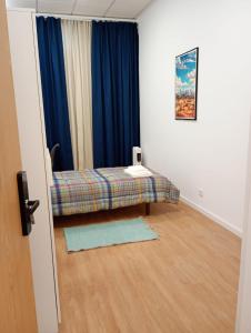 En eller flere senge i et værelse på BBGH Guest House