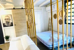 a bedroom with a bunk bed in a room at Villa cactus in Goyave