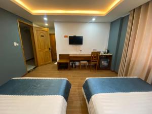 Et tv og/eller underholdning på New Merry Hotel And Spa