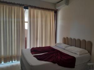 a bed in a bedroom with a large window at Pousada da Sol na Praia do Frances in Praia do Frances +19 photos