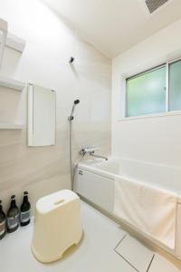 Et badeværelse på ビジネス&長期ステイコテージ