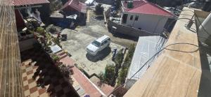 an aerial view of a car parked in a yard at Maitreya Homestay in Tawang