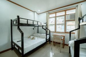 Postel nebo postele na pokoji v ubytování Mia Bae Lodge