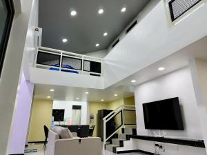 Et tv og/eller underholdning på 快乐客栈 Sentosa Cottage