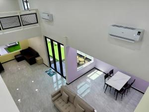 Et opholdsområde på 快乐客栈 Sentosa Cottage