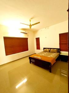 Ένα ή περισσότερα κρεβάτια σε δωμάτιο στο Chakkanthara's pool villa