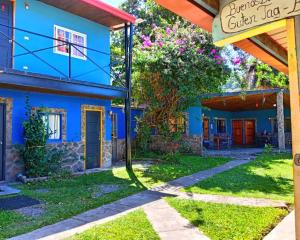 a blue house with a basketball hoop in the yard at La Lune Topaz in Boquete