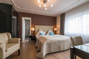 Postel nebo postele na pokoji v ubytování Hotel 'Zum Augarten'