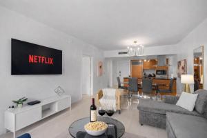 a living room with a couch and a table at Brickell 35th Floor Residence with Saltwater Pool 5-Star Amenities in Miami