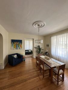 a living room with a table and a couch at BellaDonna By The Bay in Bridgetown
