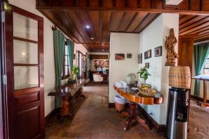 a hallway with a table in a room at Mekong Riverview Hotel in Luang Prabang
