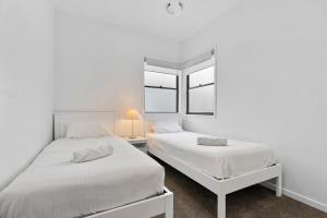 Voodi või voodid majutusasutuse Beacon Central toas