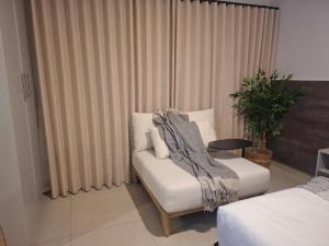 Et opholdsområde på Luama Suites + 8 billeder