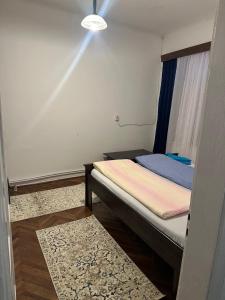 En eller flere senge i et værelse på Casa Roxana