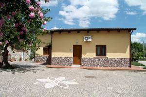 a house with a flower painted on the side of it at Nonno Domenico in Sassano