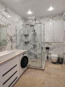 a bathroom with a shower and a toilet at Гостиница Караганда in Karagandy