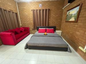 En eller flere senge i et værelse på บ้านมาดาม เขาใหญ่