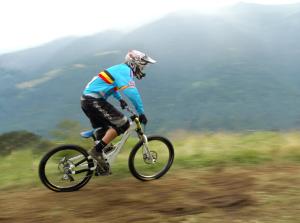 a man riding a bike down a hill at Euro Hotel in Edolo