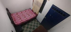 En eller flere senge i et værelse på Alojamiento Abejorral