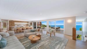 an open living room with a view of the ocean at 'Ocean Pearl' by HolidayCo in Hardys Bay