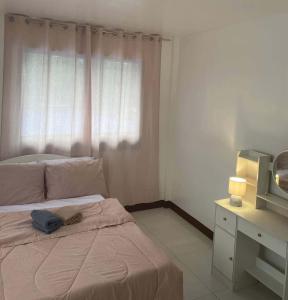 Ένα ή περισσότερα κρεβάτια σε δωμάτιο στο Xstaycation +1 φωτογραφίες