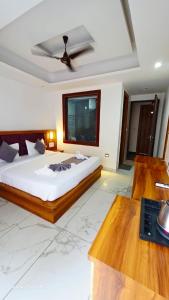 En eller flere senge i et værelse på Hotel Tapomay Retreat + 2 billeder