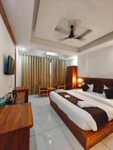 En eller flere senge i et værelse på Hotel Tapomay Retreat