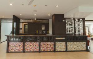 a room with a counter with colorful disks on it at Pink Residence Chalong in Ban Bang Chak +19 photos