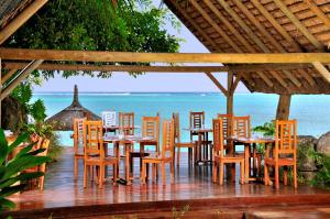 A restaurant or other place to eat at Le Cardinal Exclusive Resort