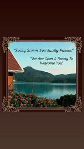 a picture frame with a picture of a lake at Serendipity Lake Artistic Bungalow by Heidis Home in Nuwara Eliya