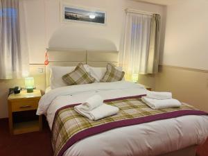 Giường trong phòng chung tại Little Silver Country Hotel