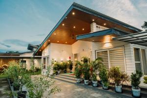 a house with plants in front of it at Vanilla Country in Dibrugarh