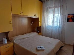 Ένα ή περισσότερα κρεβάτια σε δωμάτιο στο Accommodation with terrace and parking