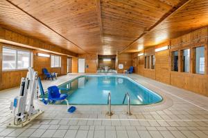 a swimming pool in a room with a wooden ceiling at Quality Inn Dubuque on Hwy 20 in Dubuque