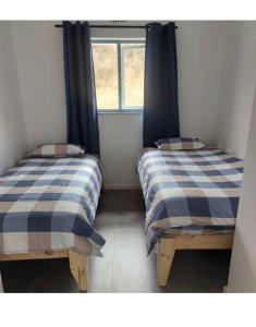 Postel nebo postele na pokoji v ubytování Kliprivier Park Tulbagh